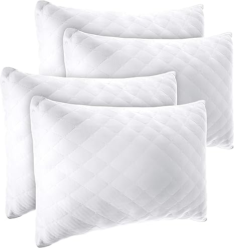 4 pillows on bed