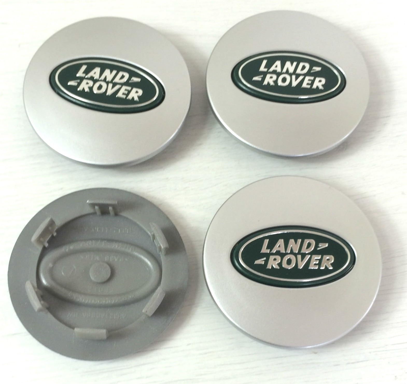 4 x Land Rover 63&nbsp;mm wheel hub covers silver/green logo