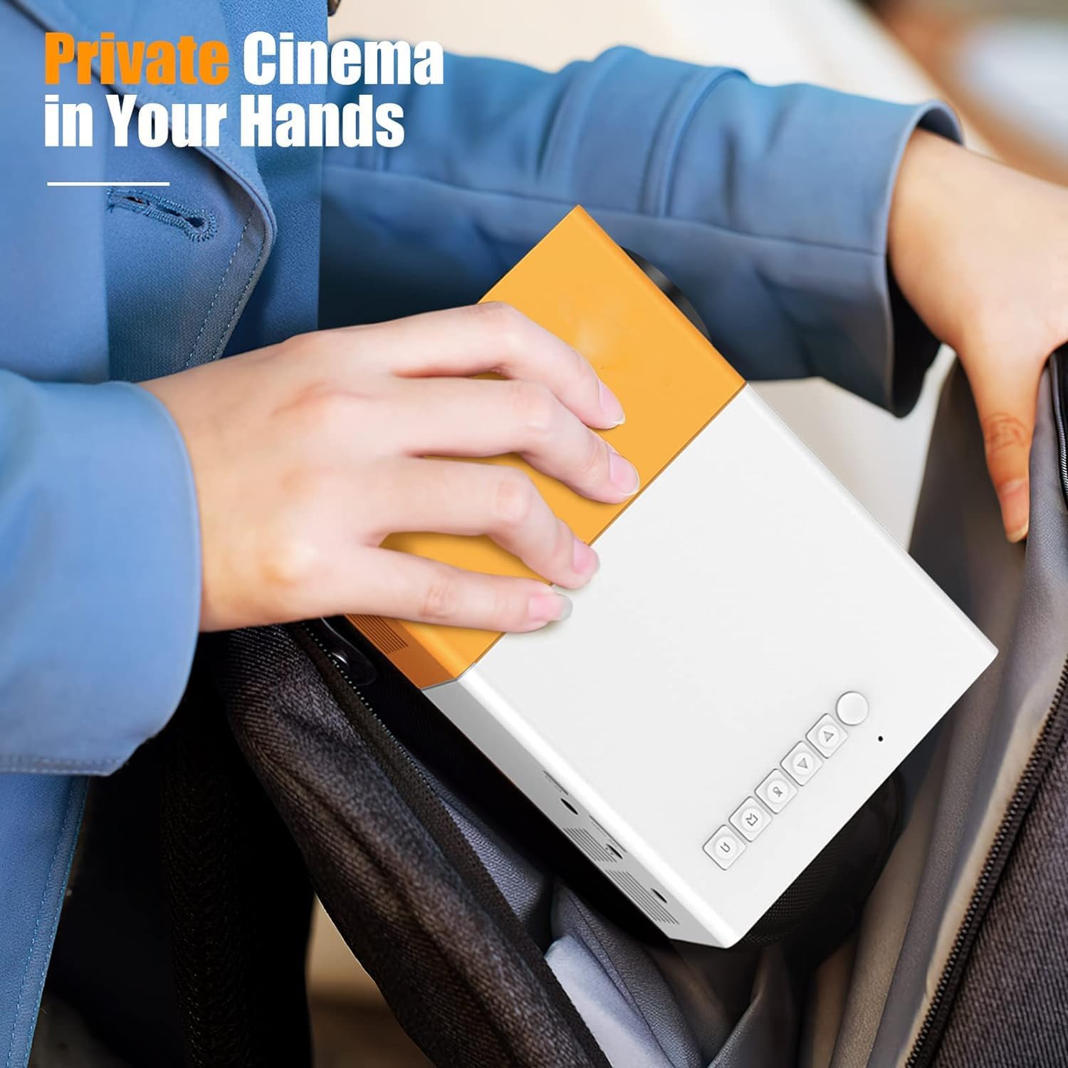 Person placing the T300 Mini Projector into a bag, highlighting its portability.