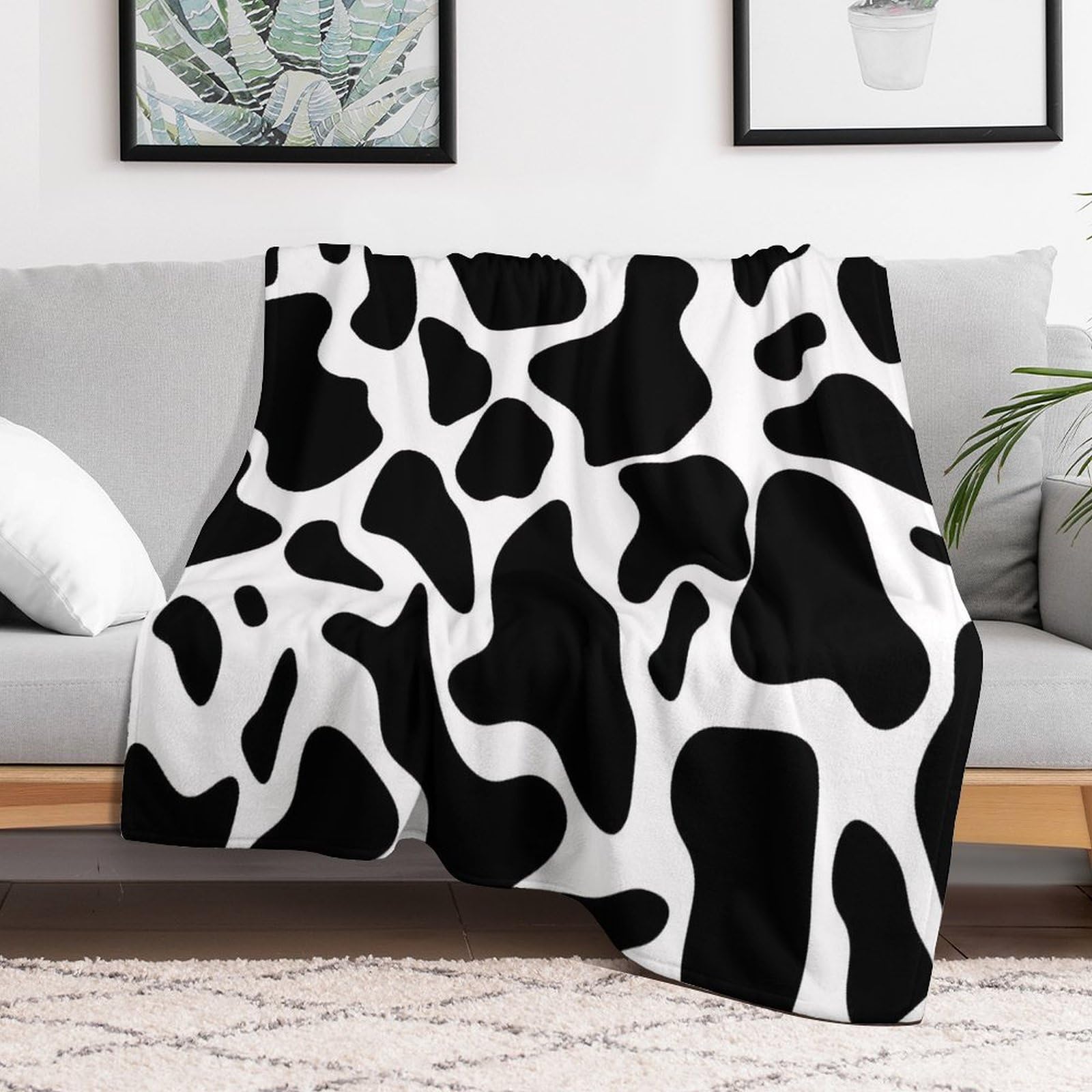 Couverture à pois de vache plaid polaire léger pour réchauffer les nuits fraîches de lit