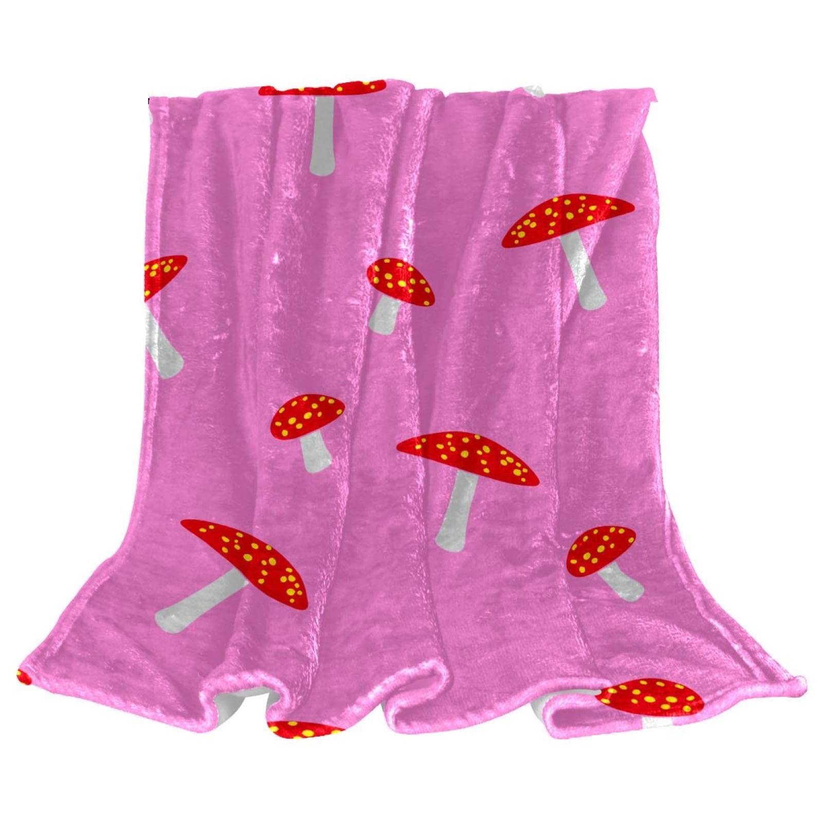 Couverture polaire champignon rose rouge pour réchauffer les soirées cocooning sur le canapé