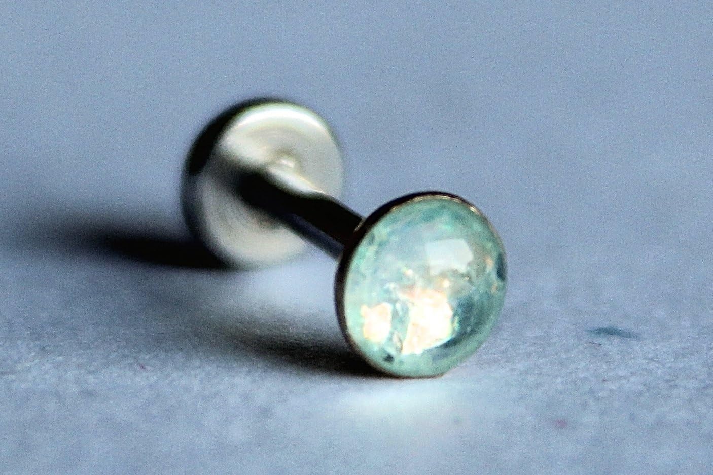 18g or 16g: Opalescent Baby Blue Internally Threaded Labret Stud: 1.5mm, 2mm, 2.5mm, 3mm, 4mm, 5mm Gem Sizes; 5/32" (4mm), 1/4" (6mm), 5/16" (8mm), 3/8" (10mm), 15/32" (12mm); 316L Surgical Steel