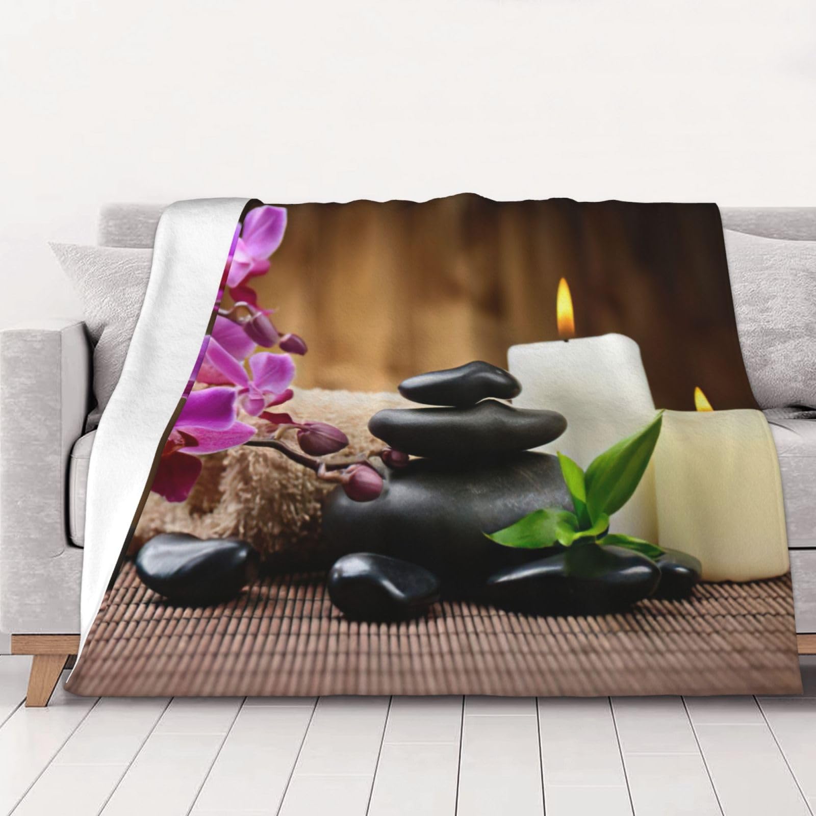 Couverture flanelle galets zen pour soulager le stress du soir