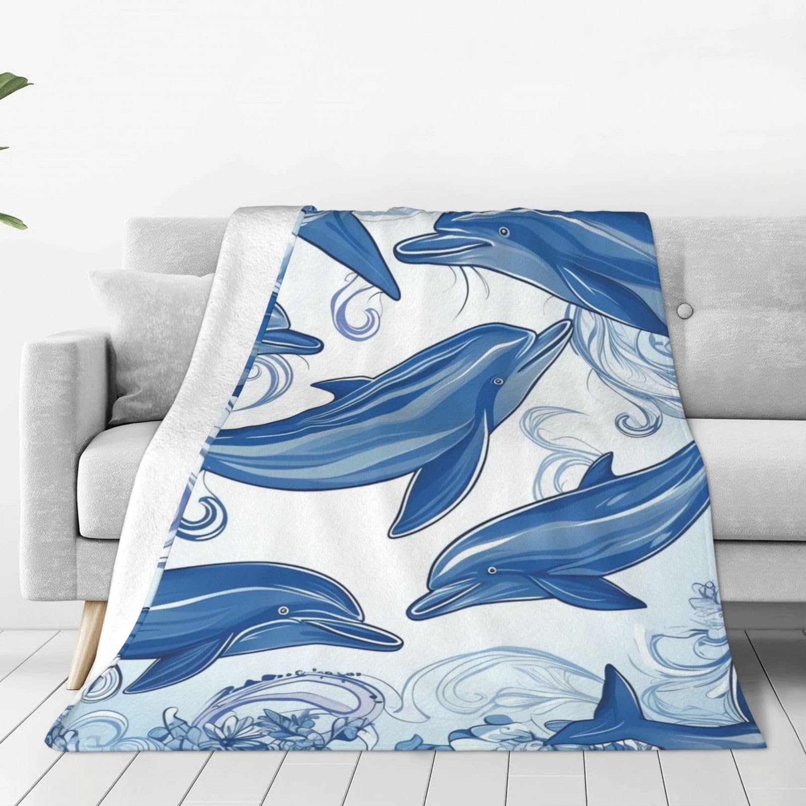 Couverture polaire dauphin pour vos soirées cocooning et moments de détente sur le sofa