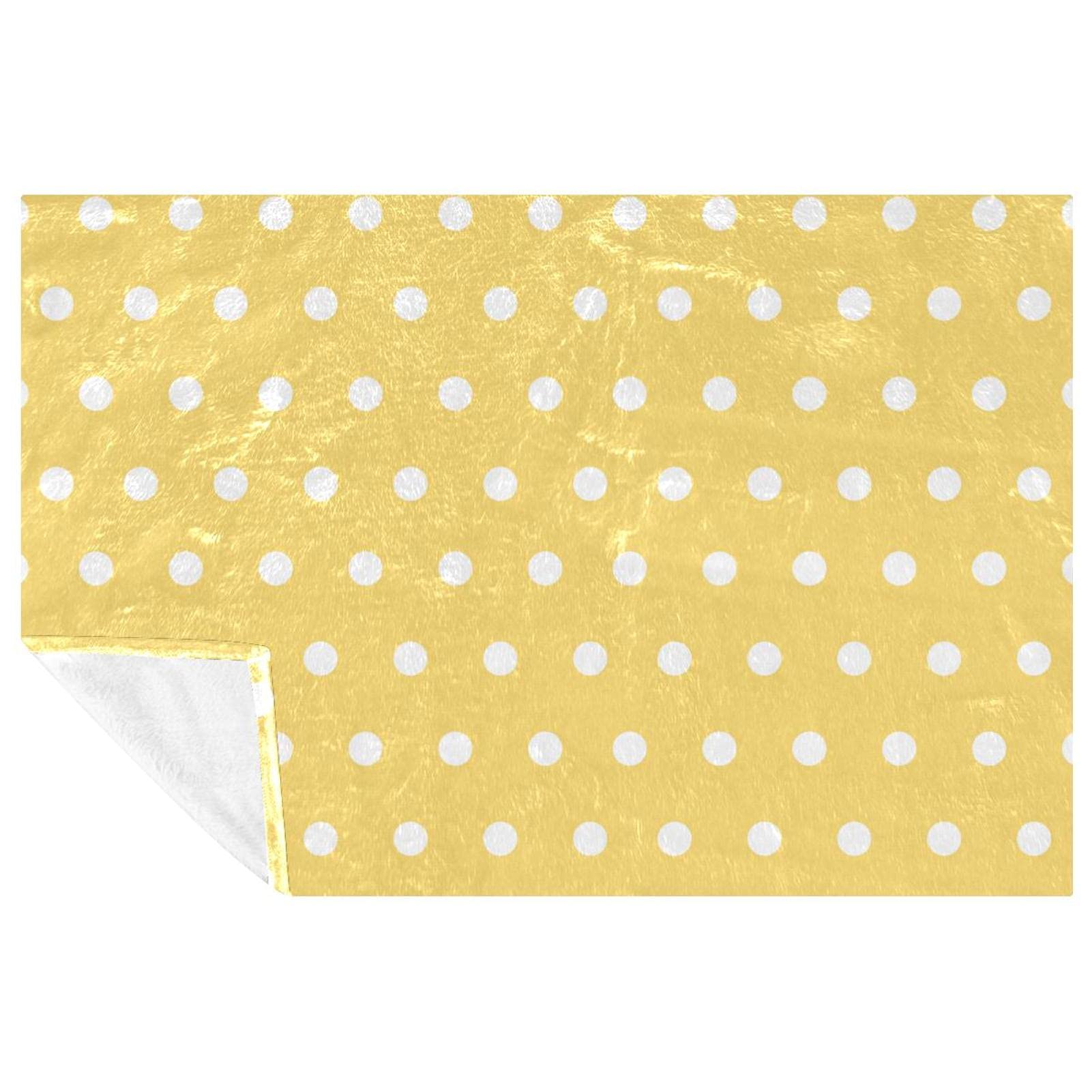 Couverture jaune à pois blancs idéale pour vos soirées sur le canapé ou pique-nique en plein air