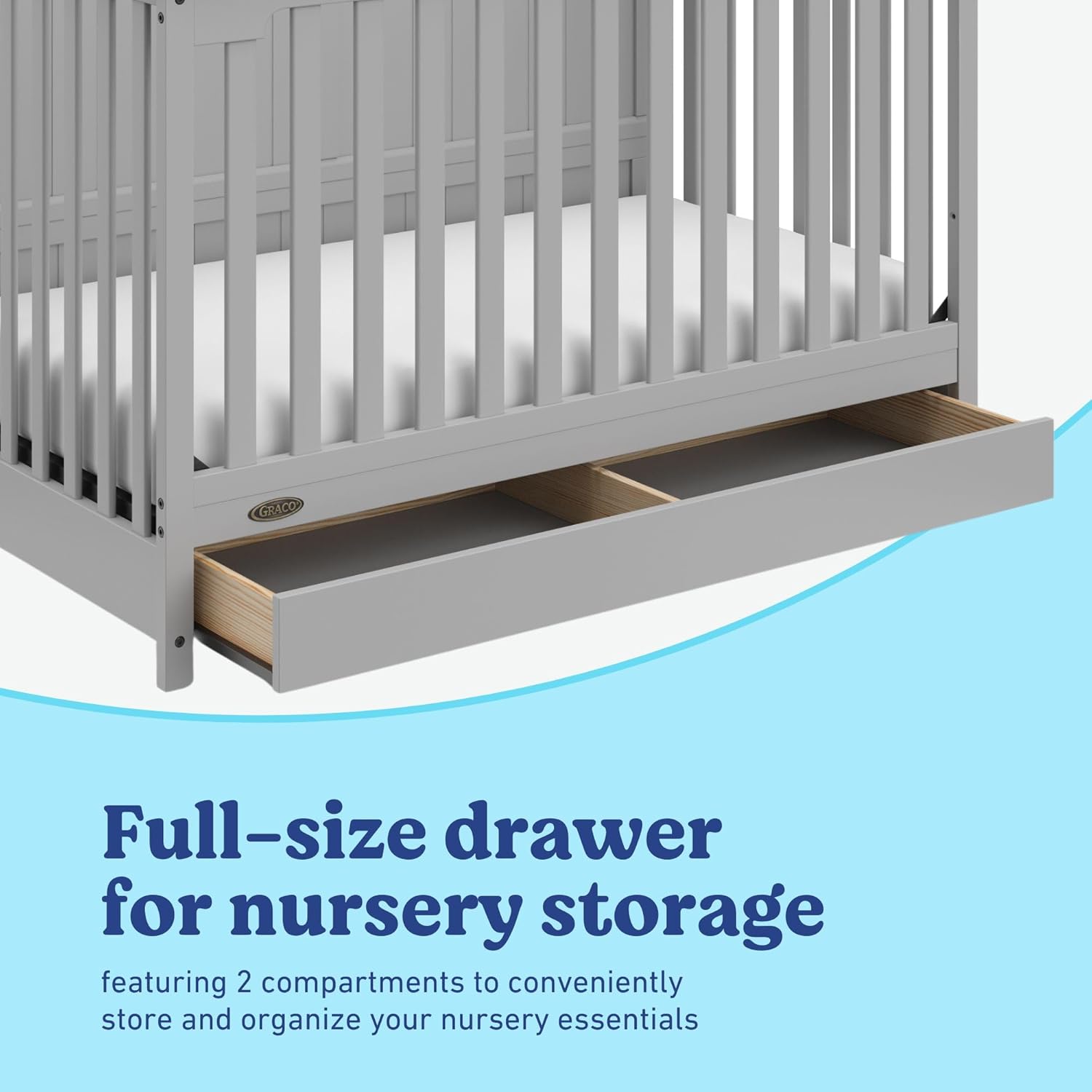 Bressol Graco Hadley amb calaix d'emmagatzematge de mida completa obert, que mostra dos compartiments