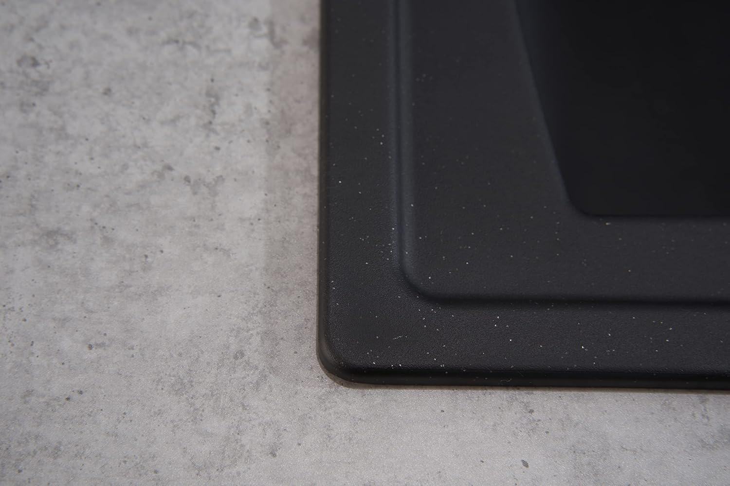 Close-up of the textured edge of the Respekta ALINEO100 black sink