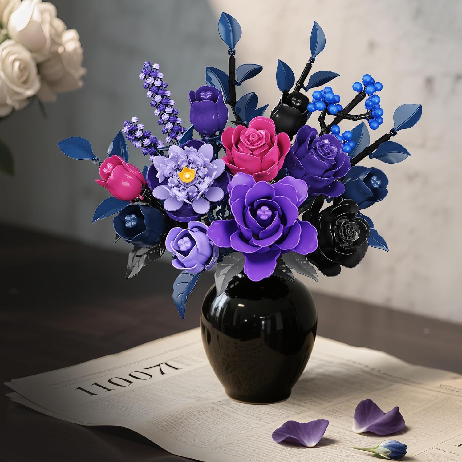 The assembled HiWEEGO SC8843 Flowers Bouquet Building Set in a vase on a table with books.