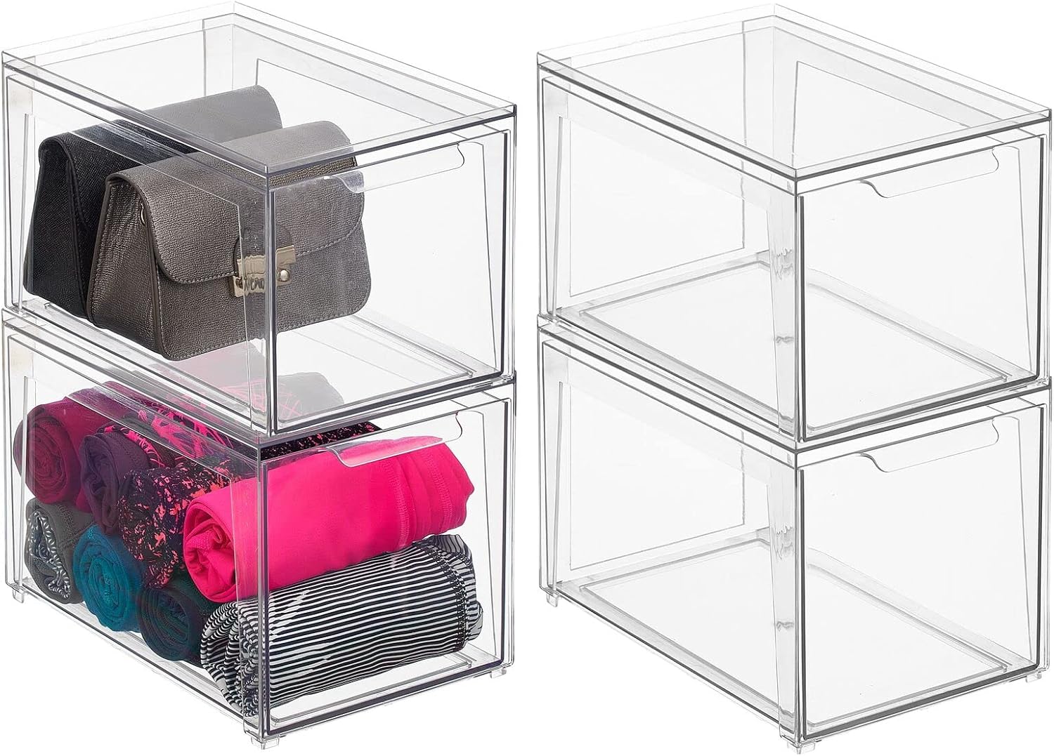 Two sets of mDesign clear stackable storage bins, one set with items like purses and folded clothes, the other empty.