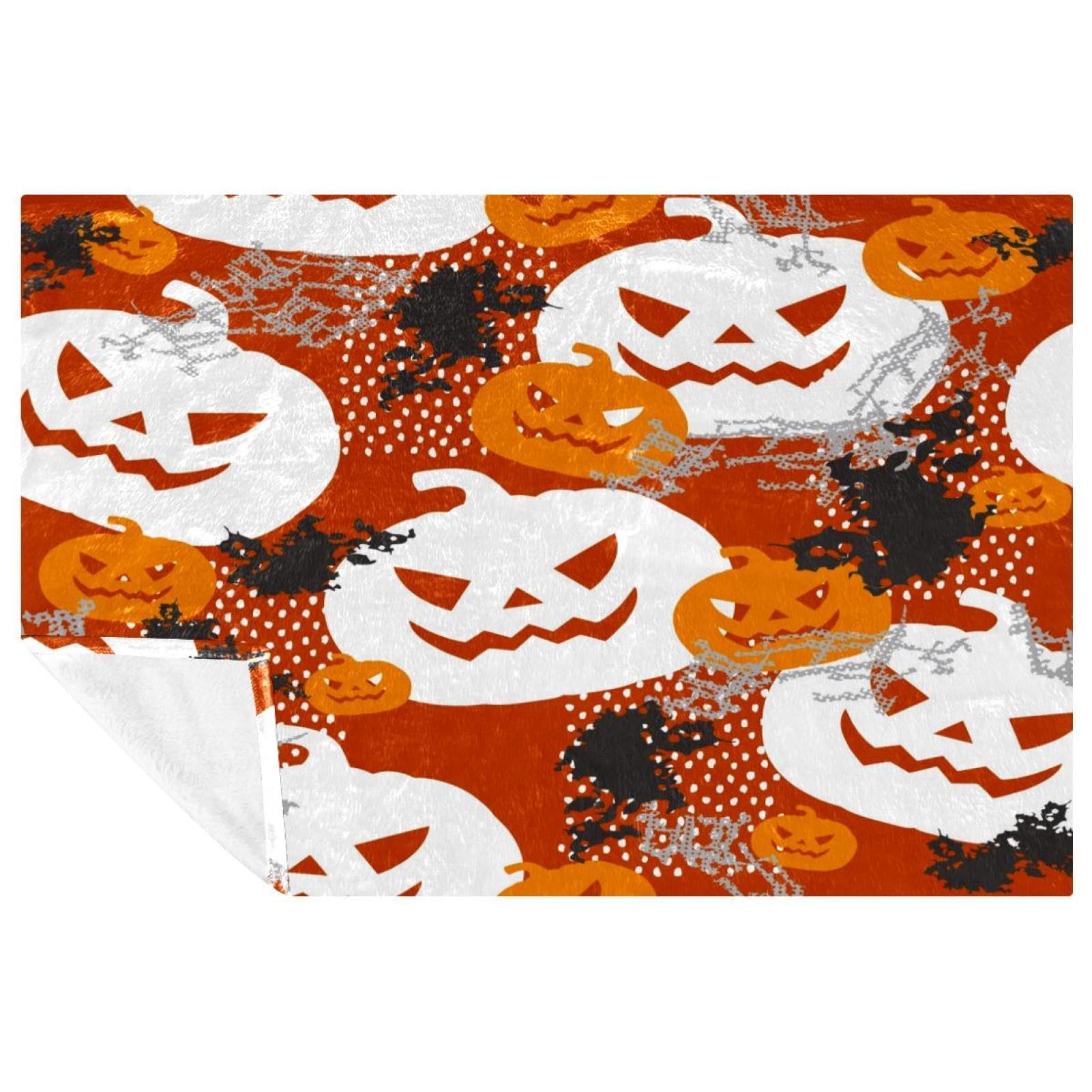Couverture chaude citrouilles Halloween grunge contre le froid sur votre lit ou canapé