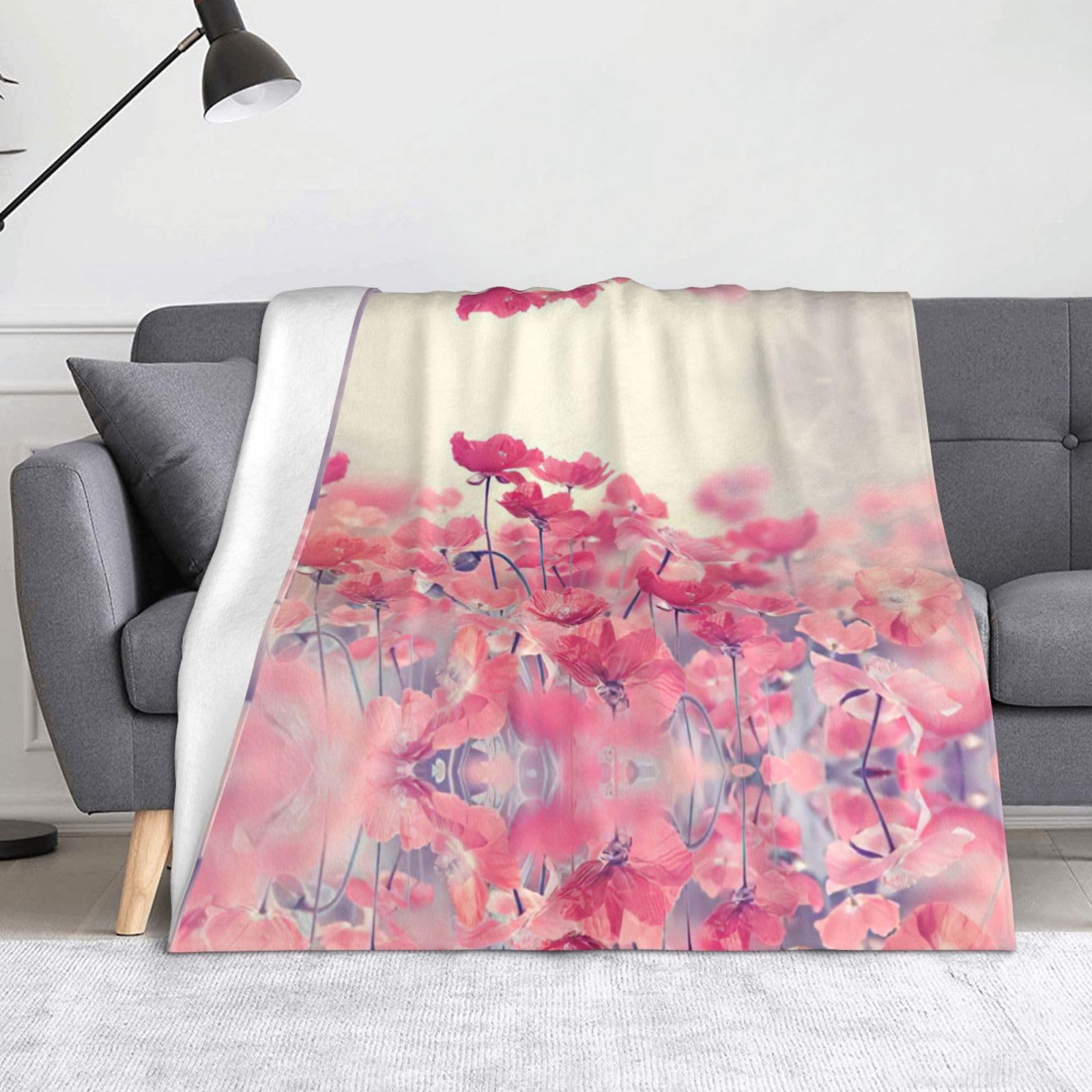 Couverture en polaire fleurie pour habiller votre canapé lors des soirées cocooning