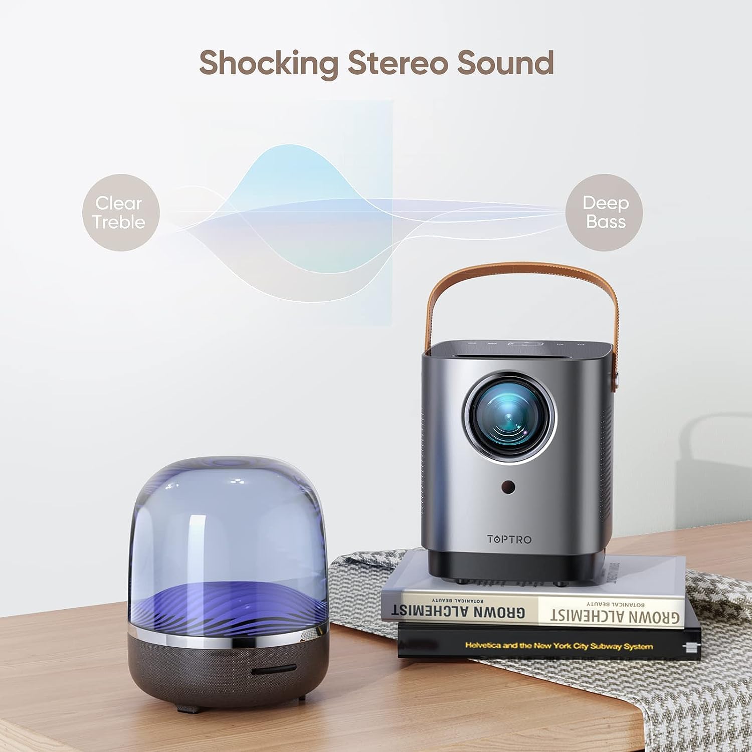 TOPTRO TR23 projector next to a speaker, illustrating clear treble and deep bass