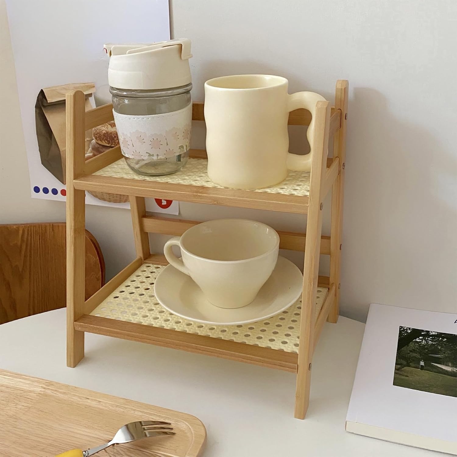 Lovskoo Desktop Storage Rack holding two cups and a saucer.