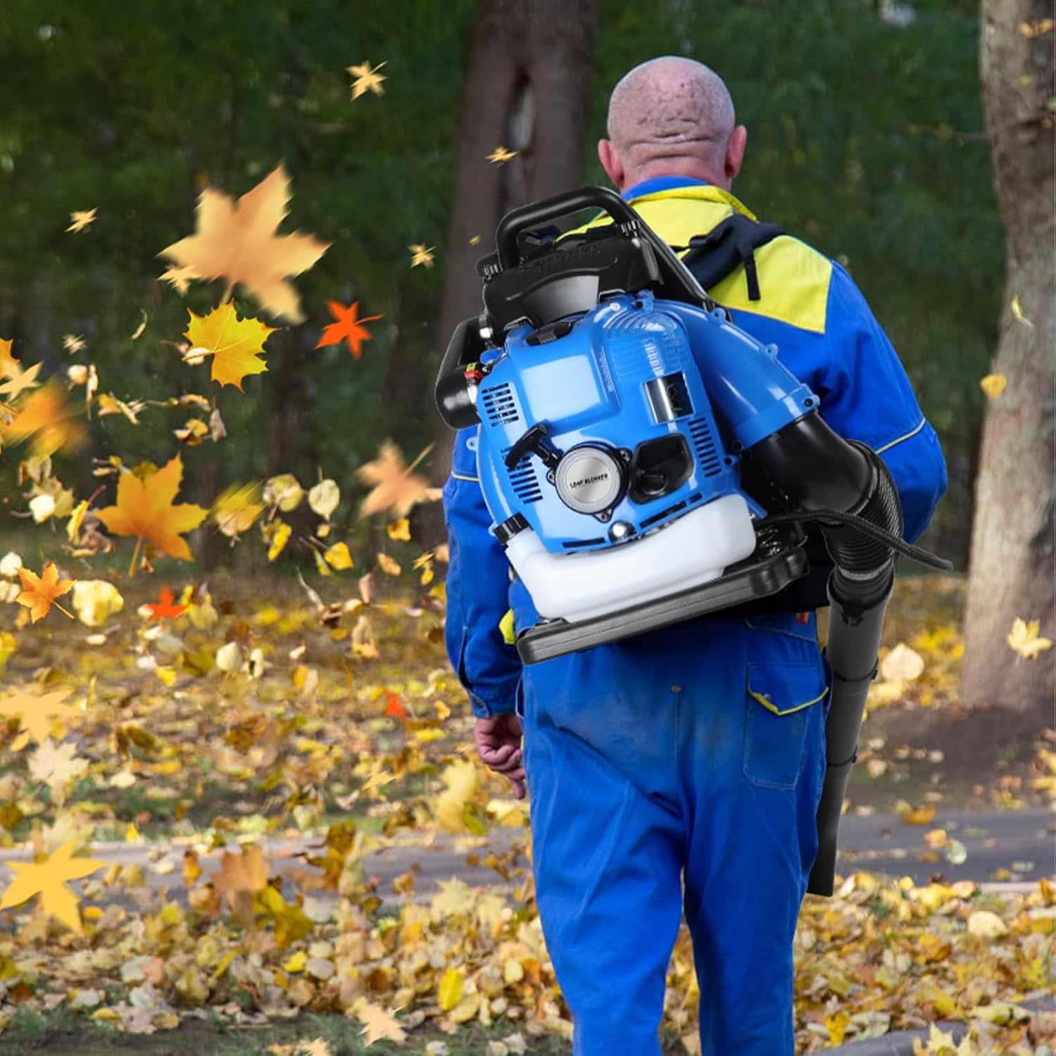 User wearing the backpack leaf blower while clearing leaves in a yard.