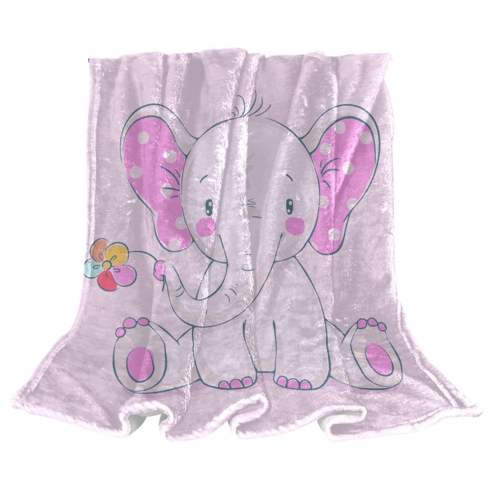 Couverture microfibre papillon rose pour des moments cocooning chaleureux sur le canapé