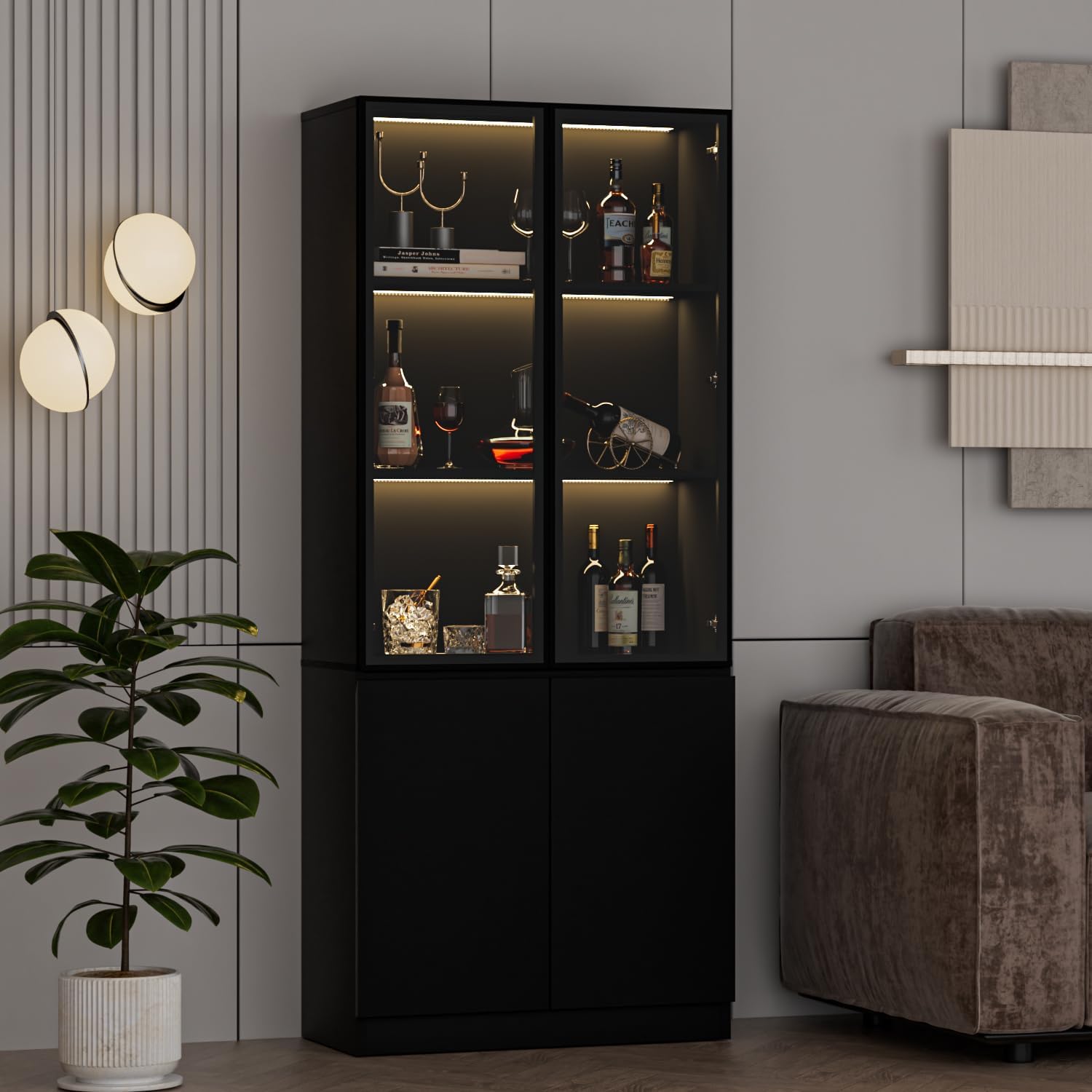 Black display cabinet with glass doors and internal lighting, showcasing decorative items and bottles.