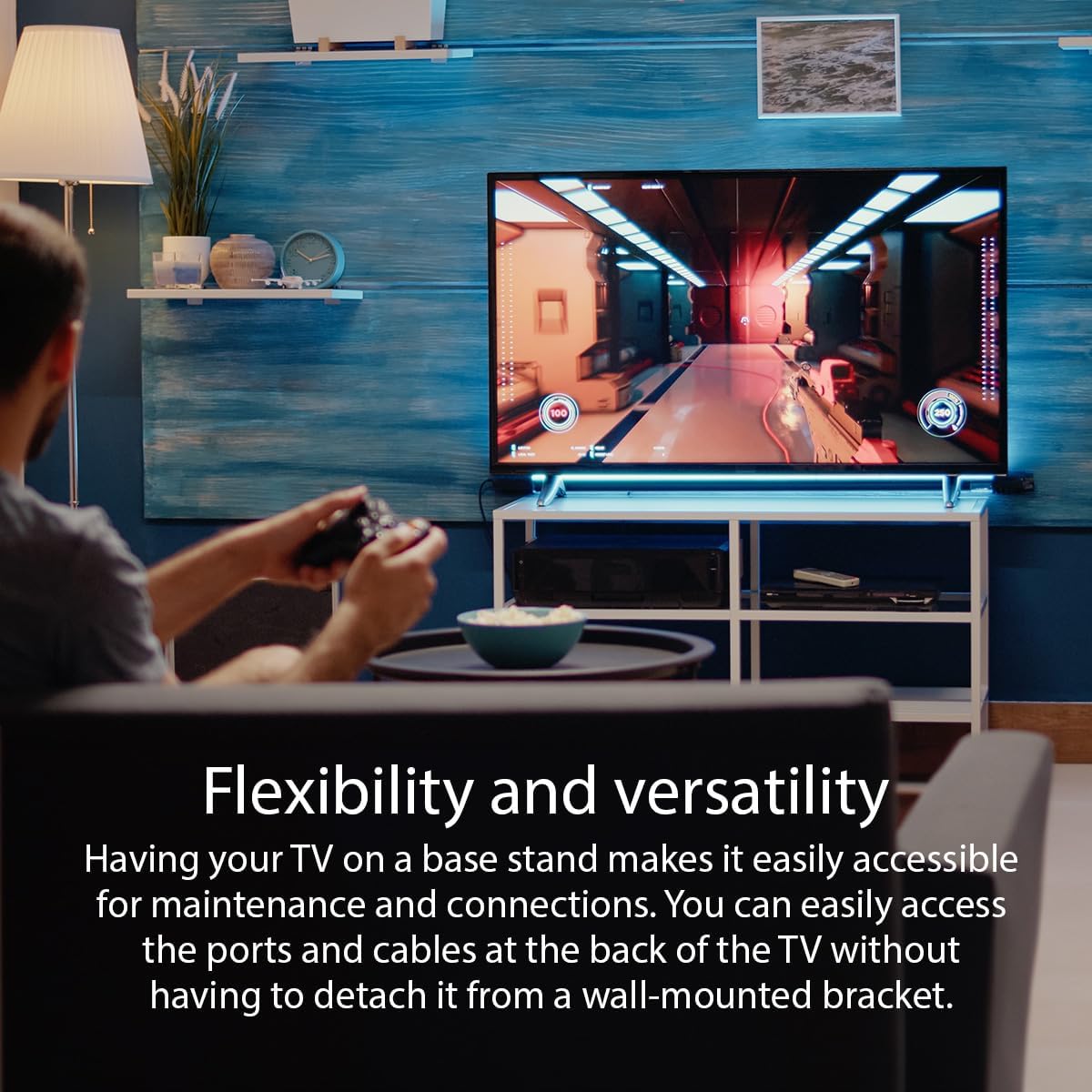 Image showing a person playing video games on a TV placed on a stand, with text 'Flexibility and versatility'