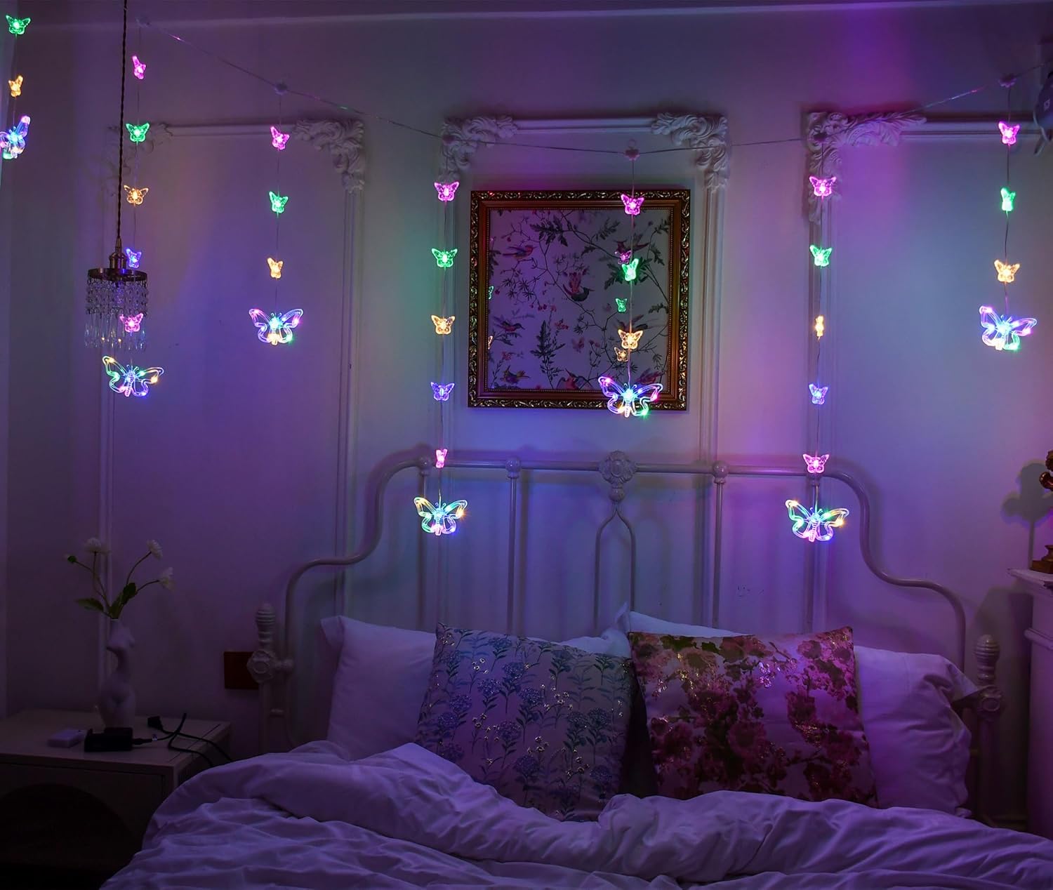 multicolor butterfly curtain lights styled in a bedroom