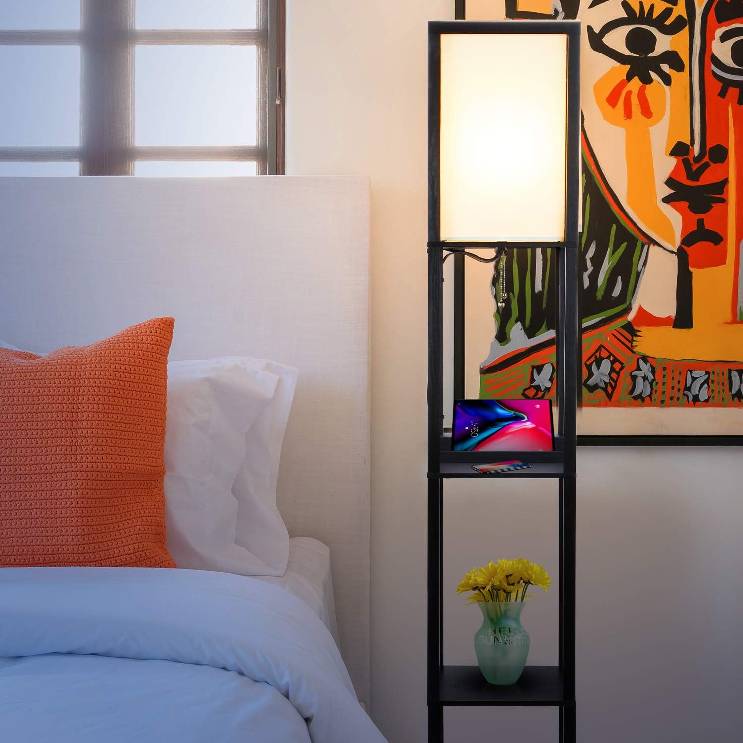 Close-up of phone wirelessly charging on Brightech Maxwell lamp