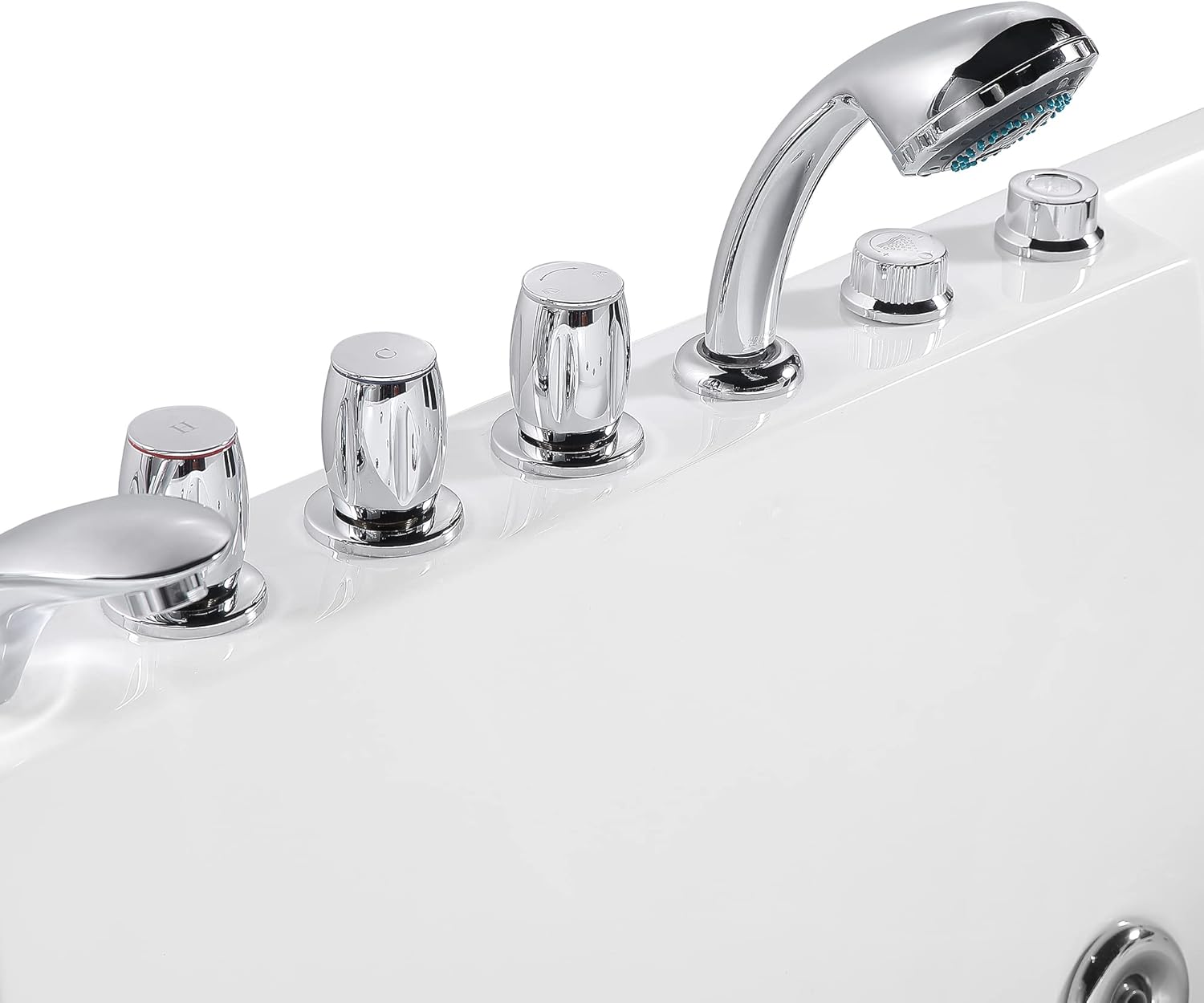 Close-up of the bathtub's control knobs and handshower.