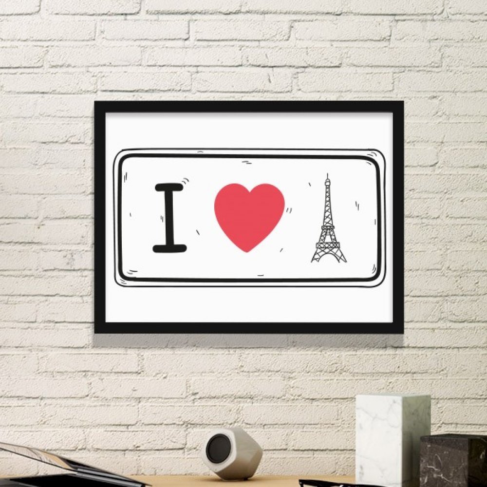 Tableau Tour Eiffel imprimé avec cadre noir pour créer une ambiance parisienne au salon