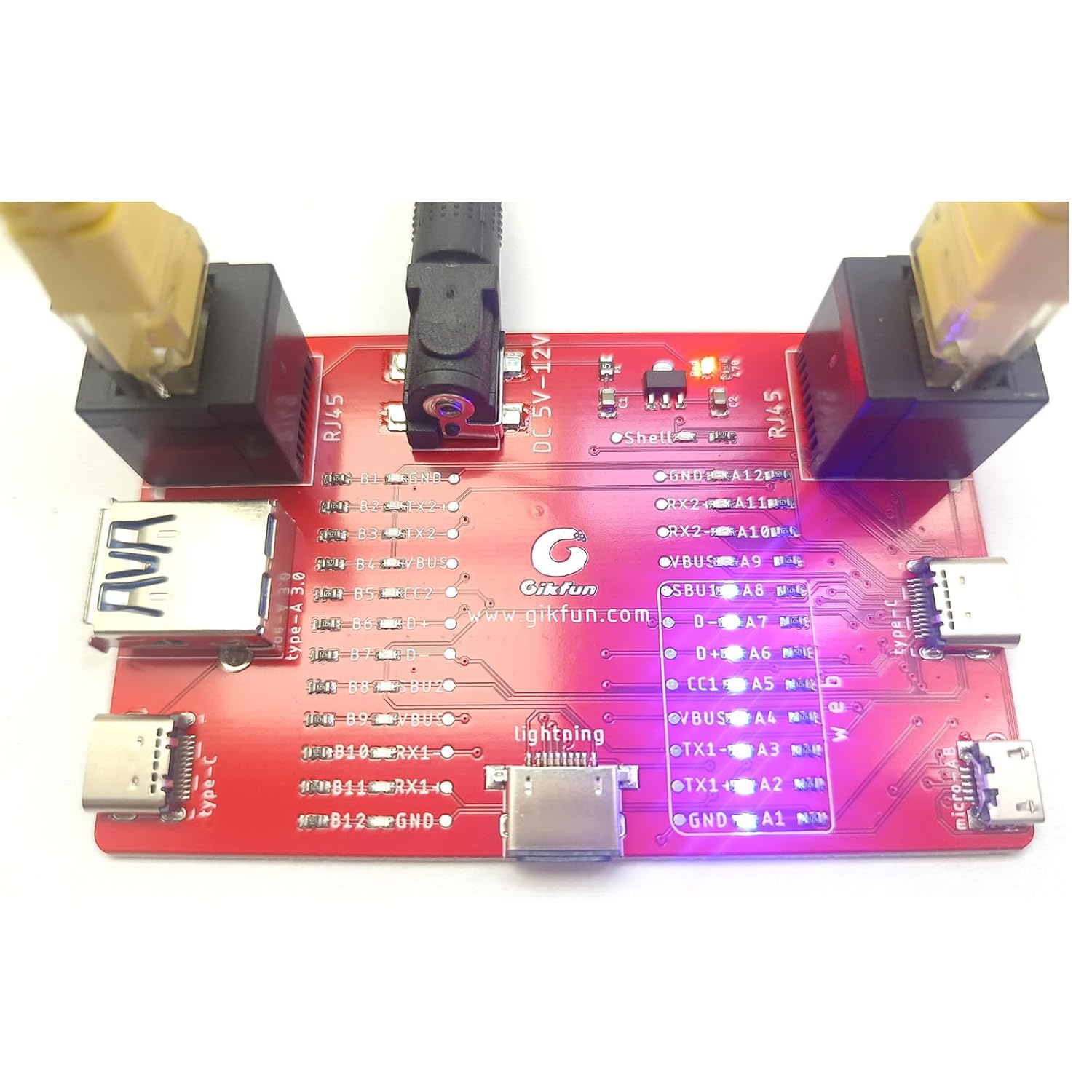 Gikfun USB Cable Tester Board with an RJ45 network cable connected, showing illuminated LEDs.