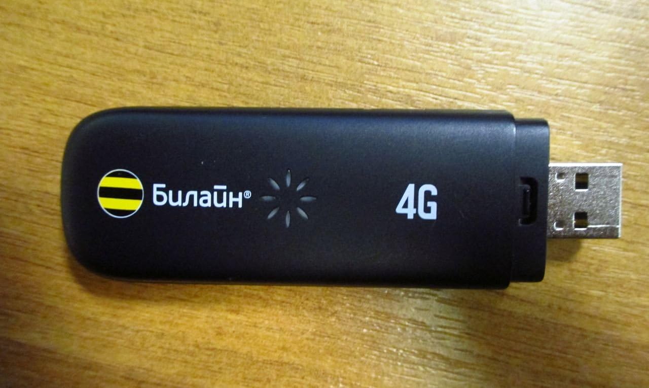 ZTE MF823 4G LTE USB Modem, black, showing the USB connector and 4G branding.
