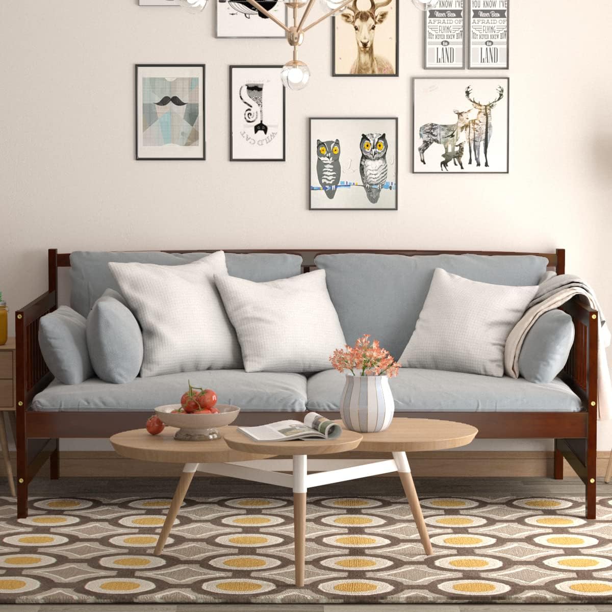 KOMFOTT Wood Daybed Frame configured as a sofa with cushions and a coffee table