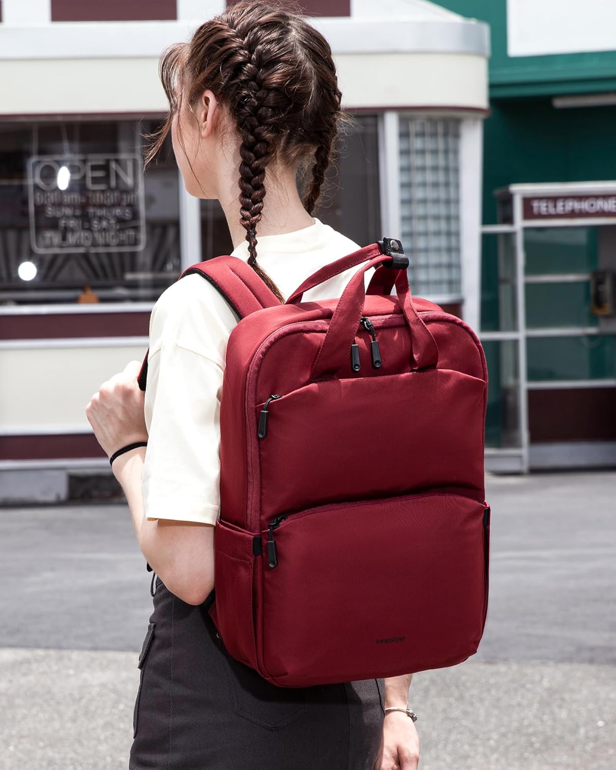 A person wearing the Innostyle Travel Backpack P21, demonstrating its fit and style.