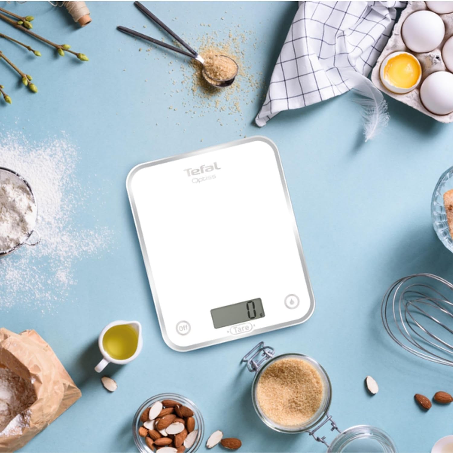 Tefal Optiss BC5000V1 Digital Kitchen Scale being cleaned with a cloth