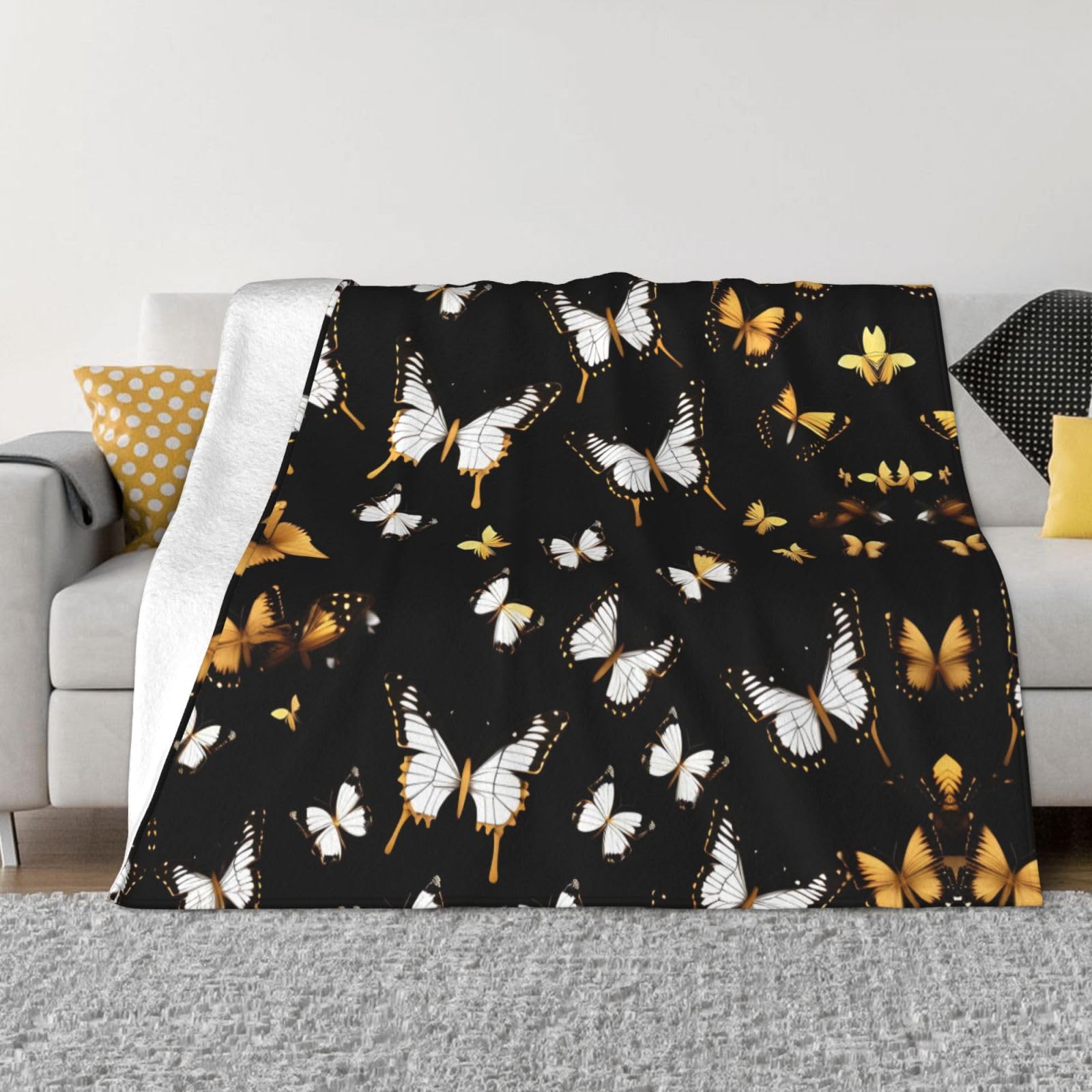 Couverture douce papillons dorés pour des soirées cocooning et chaleureuses sur le canapé