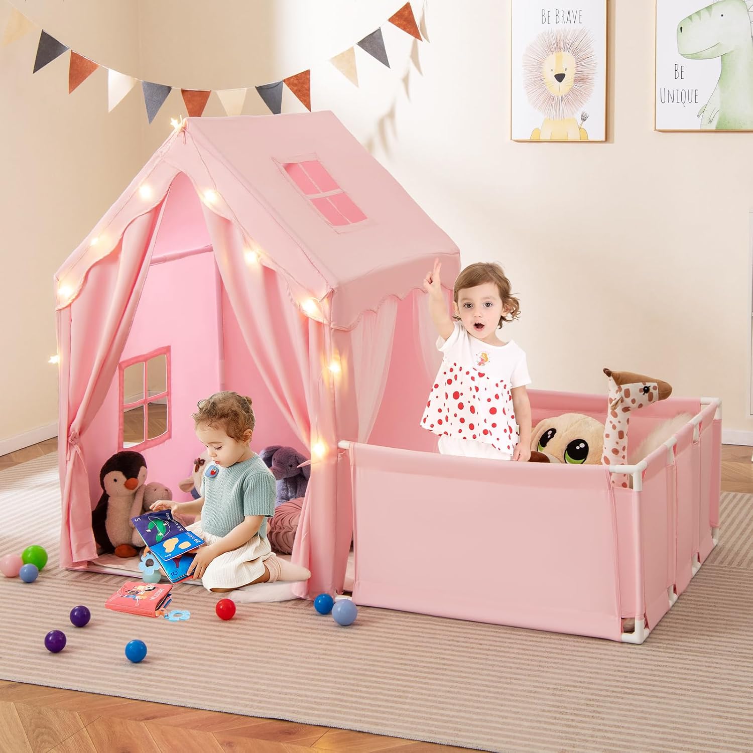 Image showing the assembled pink play tent and playpen with two children playing inside, demonstrating the dual-purpose design.
