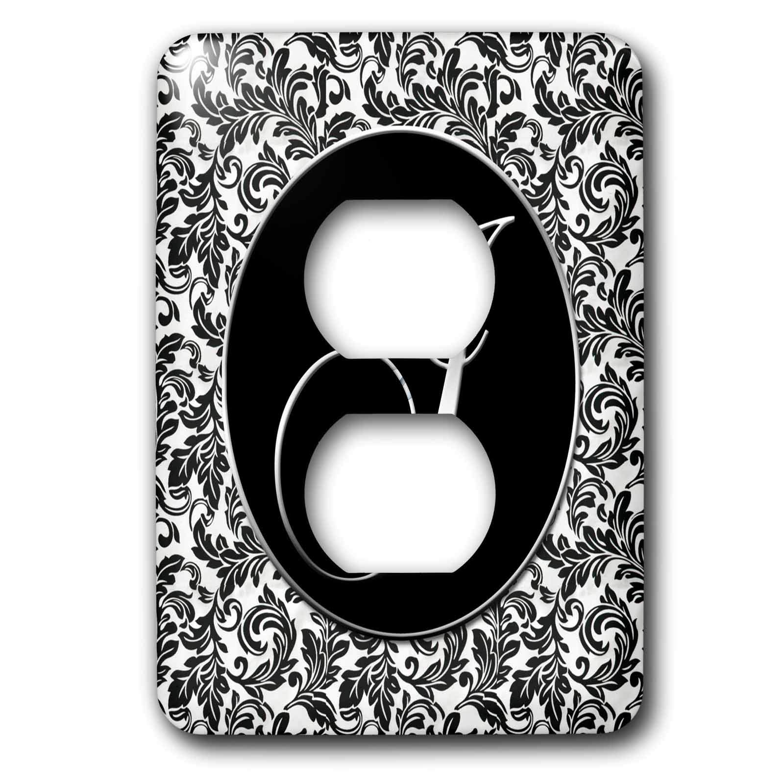 Plaque decorative pour prise lettre J damas noir et blanc dans le salon