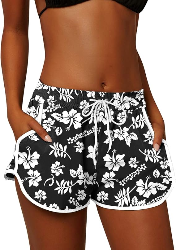 The For G and PL Women Summer Floral Beach Boardshorts with Pockets Swim Trunks are designed for comfort and style during the hot summer months. These boardshorts feature a vibrant floral print that is perfect for adding a pop of color to your beach or pool attire. The elastic waistband and adjustable drawstring ensure a secure and comfortable fit, allowing you to move freely and enjoy your activities without restrictions.