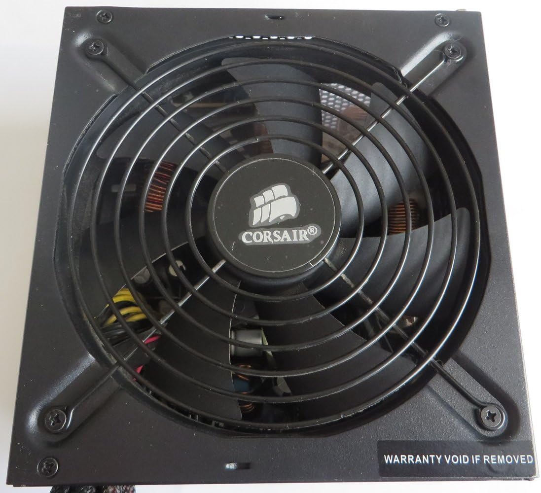 De dalt a baix view of the Corsair TX650 power supply showing the fan grille with the Corsair logo.