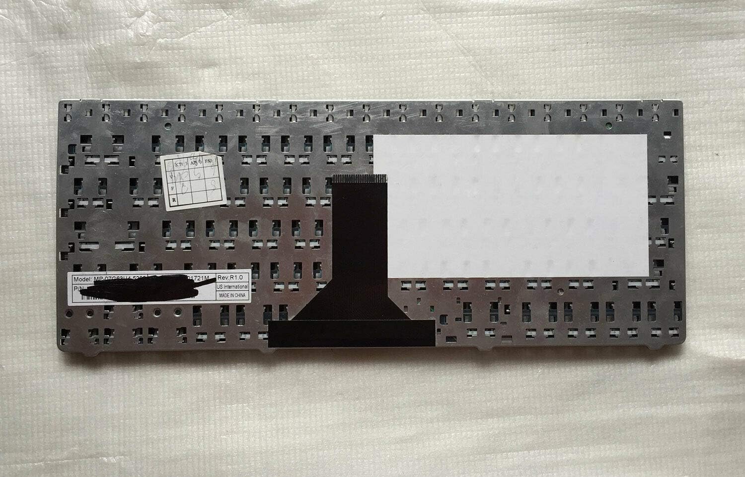 Back view of the kilter US English laptop keyboard showing ribbon cable