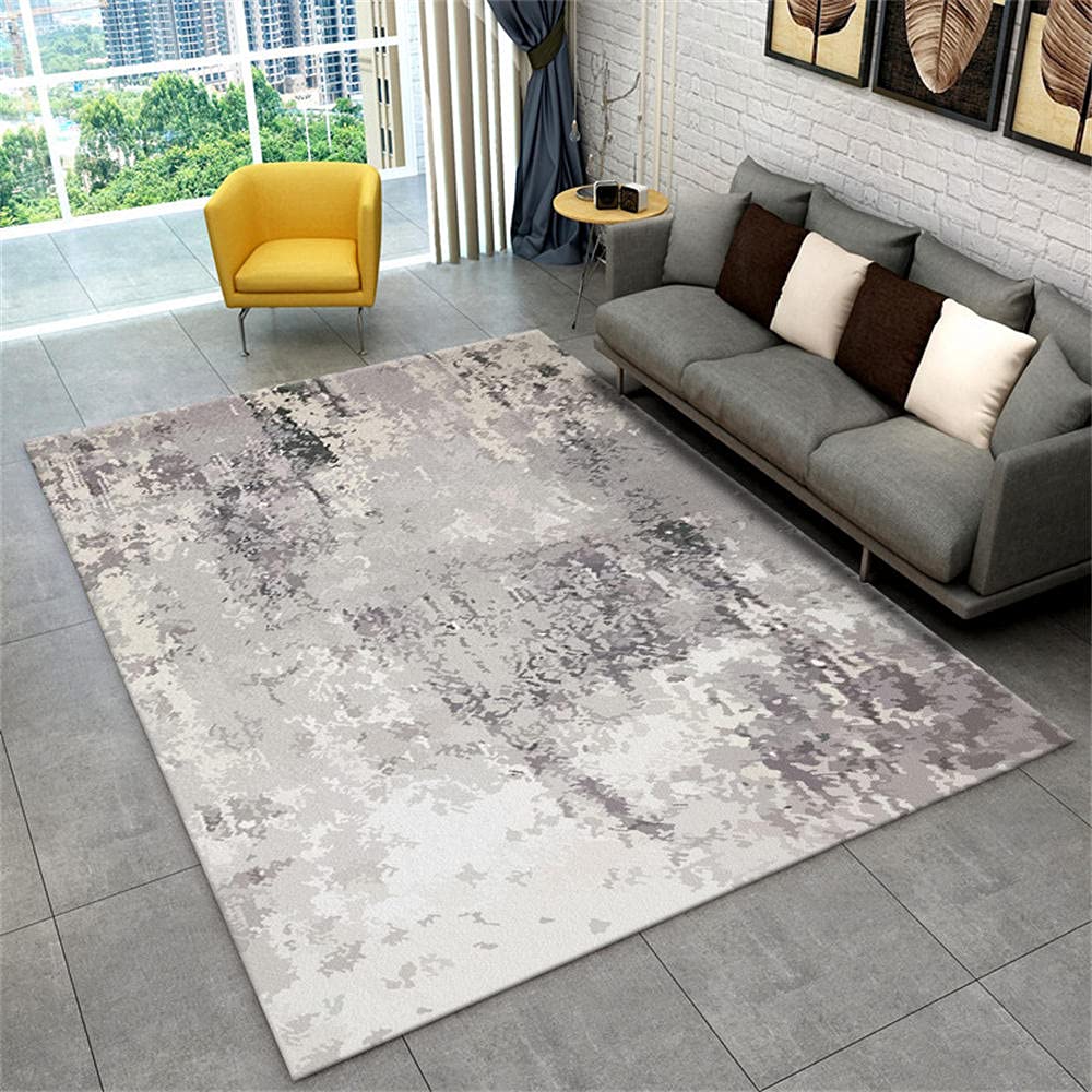 Tapis décoration salon gris abstrait créant un coin de lecture cosy