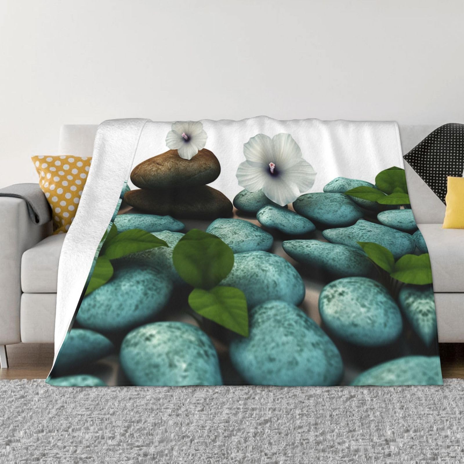 Couverture polaire imprimée fleurs pour vos moments de détente sur le canapé du salon