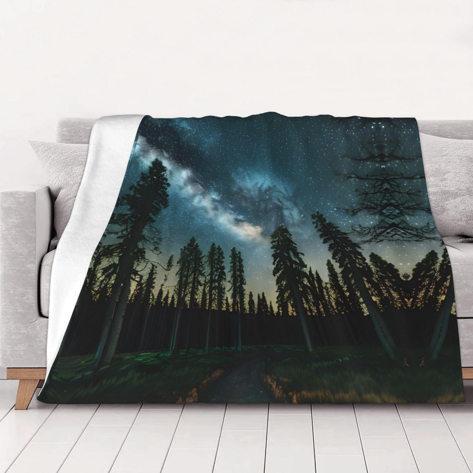 Couverture canapé motif arbres et ciel nocturne pour vos soirées cocooning et nuits douillettes