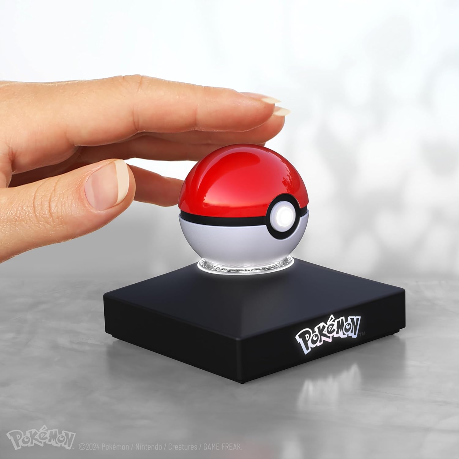 The Wand Company Pokémon Trainer Mini Poké Ball Range of Authentic Replicas - Realistic, Electronic, Die-Cast Poké Ball with Display Stand Light Features