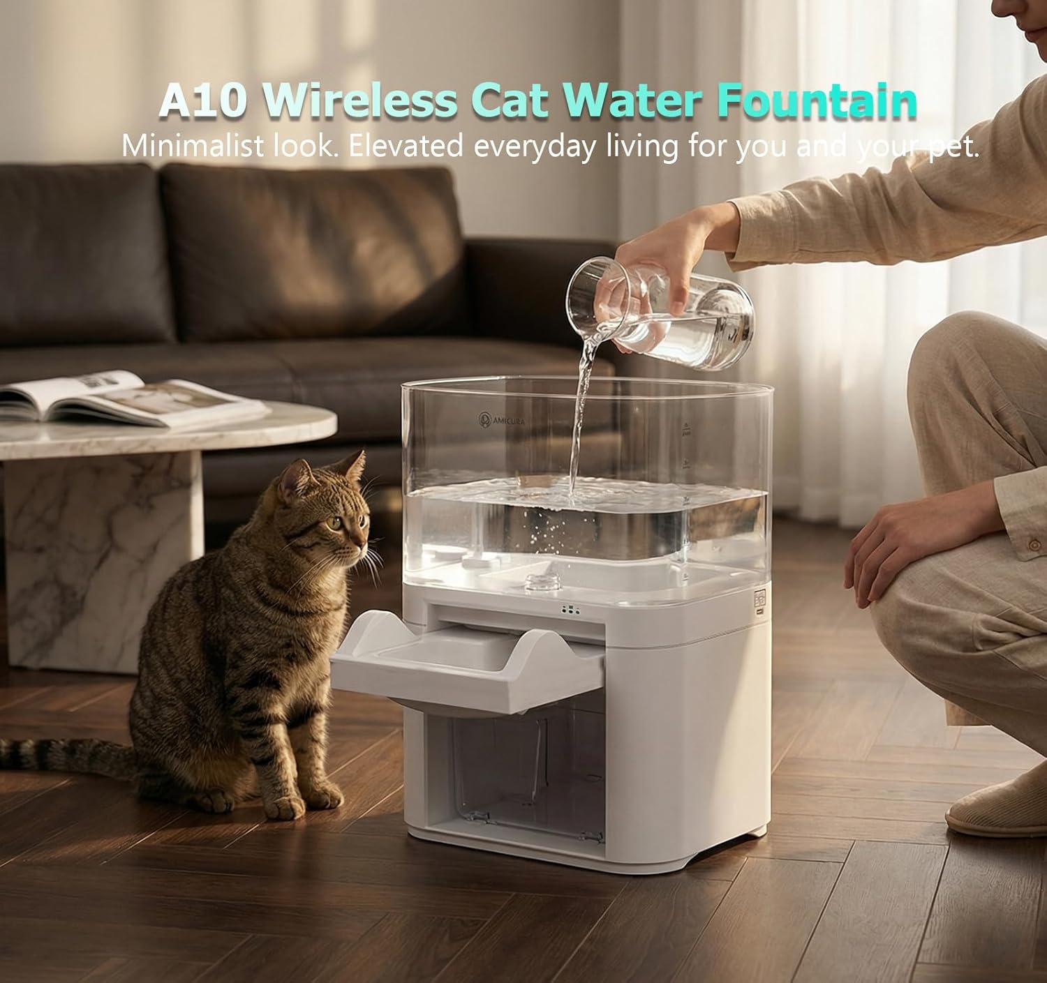 A person refilling the Amicura A10 Cat Water Fountain's fresh water tank while a cat watches.