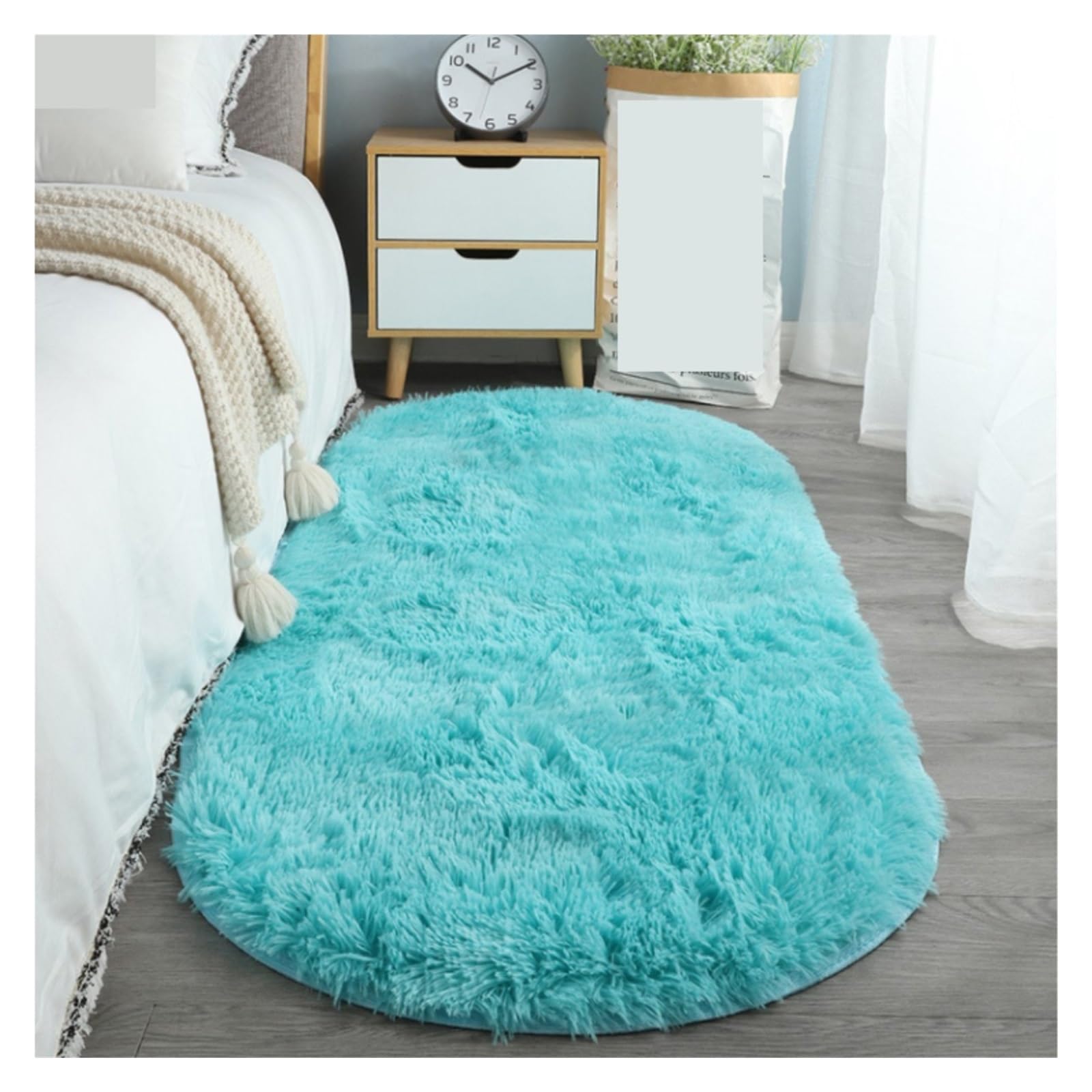 Tapis ovale en peluche isolant pour éviter le sol froid de la chambre
