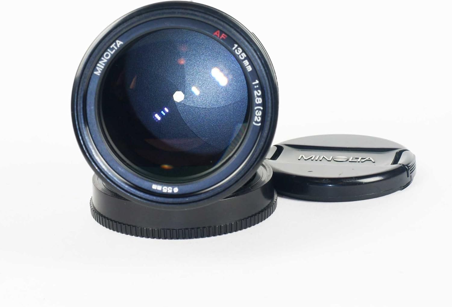 Front view of Minolta Maxxum 135mm f/2.8 lens showing the 55mm filter thread.