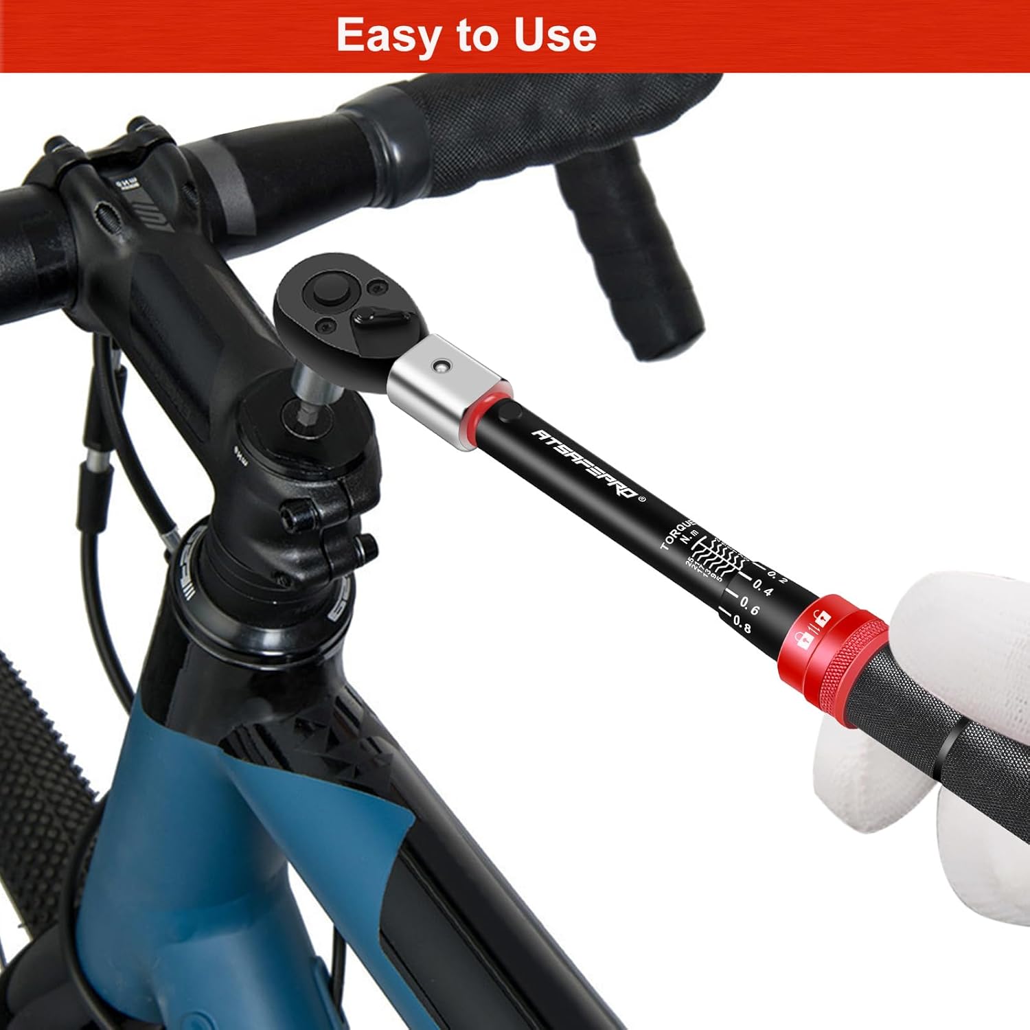 User operating the torque wrench on a bicycle component