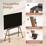 Rolling Easel TV Stand for 49-75" TVs, 88 lbs, Black | Wood-and-metal mobile TV cart, locking 360° wheels, media shelf and cable management for home, office or classroom