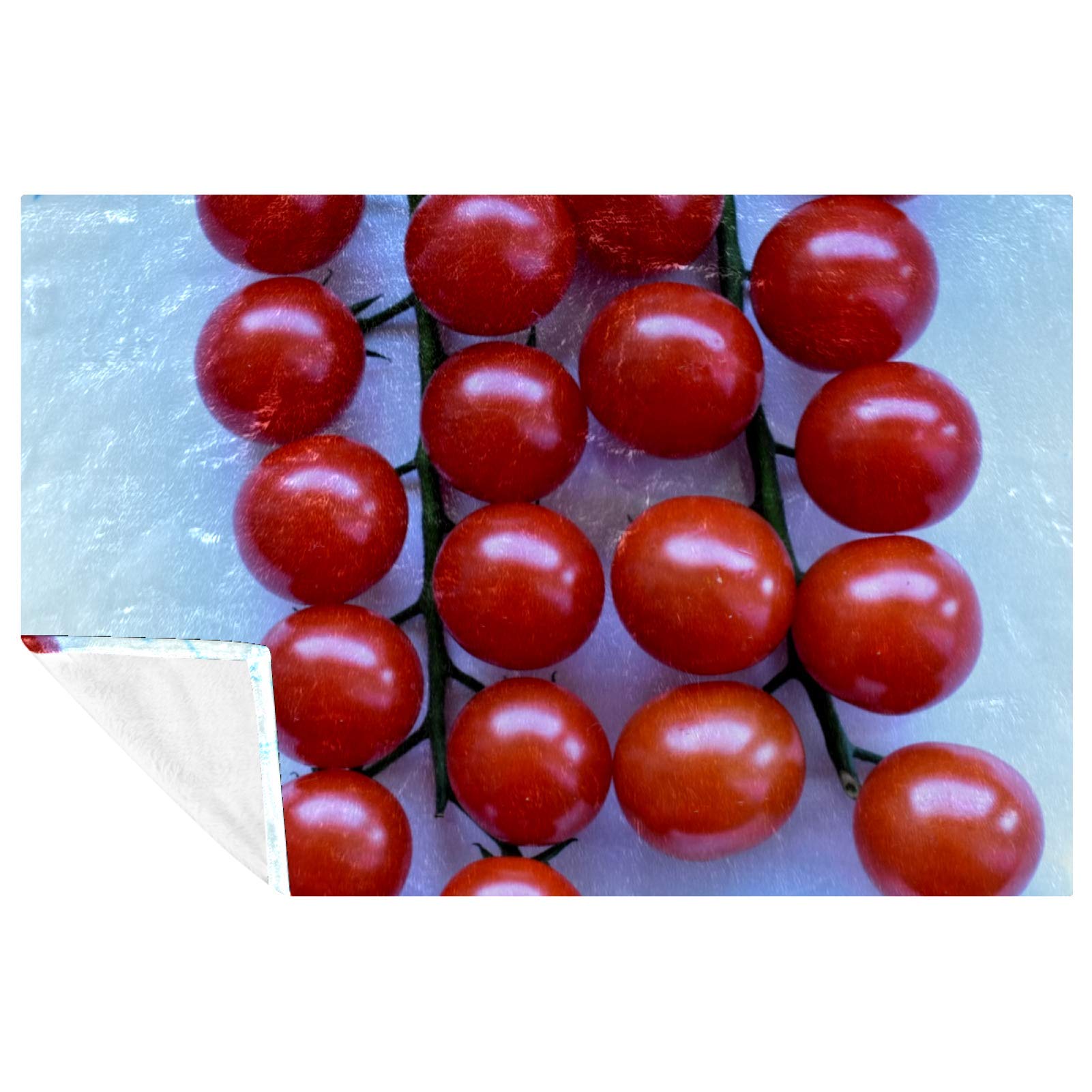 Couverture ronde tomate contre le froid sur le canapé ou au camping