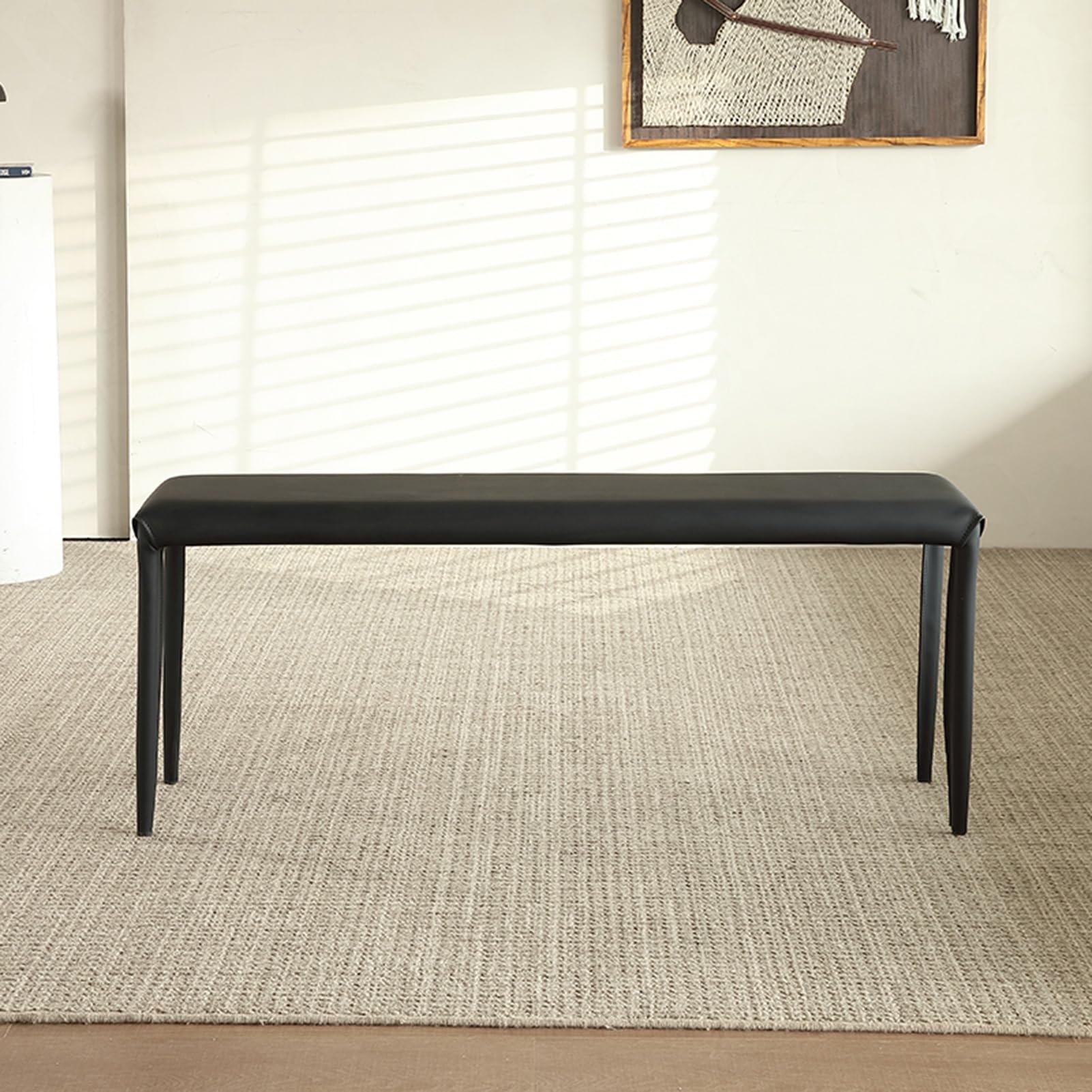 Banc range-chaussures noir avec coussin pour organiser un couloir encombré