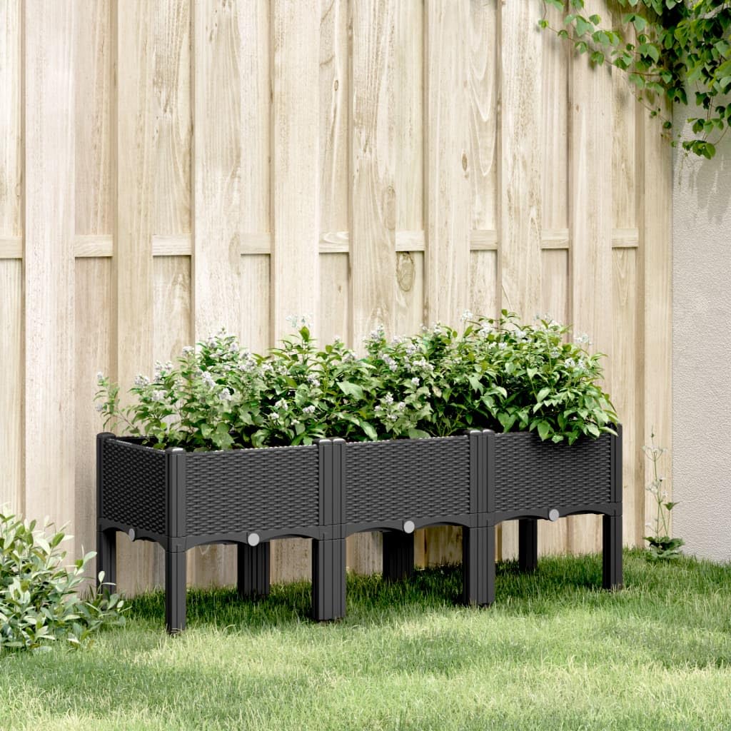 Donica ogrodowa z nóżkami czarna 120x40x42 cm PP podwyższona donica na warzywa kwiaty i rośliny pnące na taras balkon patio rattanowy design pojemnik z odpływem wody