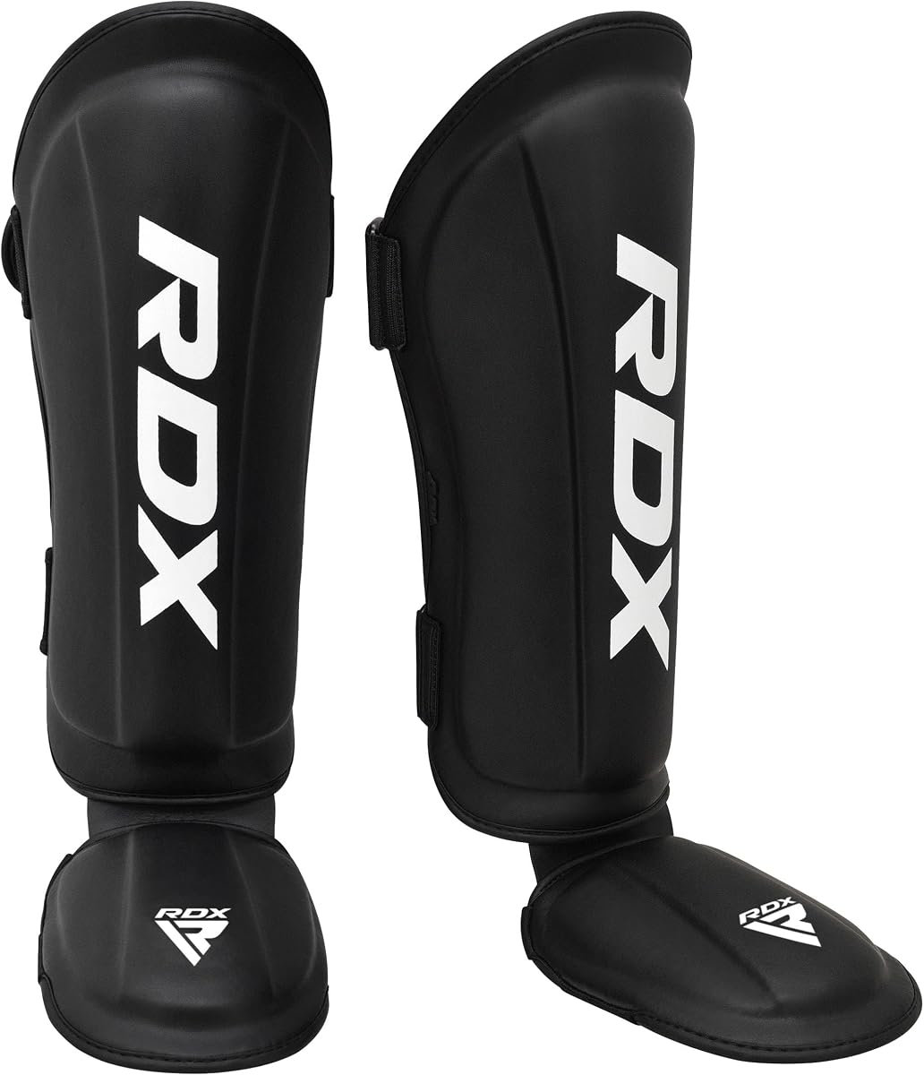 RDX Espinilleras Kickboxing Muay Thai, Aprobado por SATRA SMMAF, Cuero Maya Hide Premium, Almohadillas de protección para el empeine de las piernas, Equipo de Entrenamiento para Patadas y Sparring de Artes Marciales MMA, BJJ Karate Boxeo Taekwondo, Negro