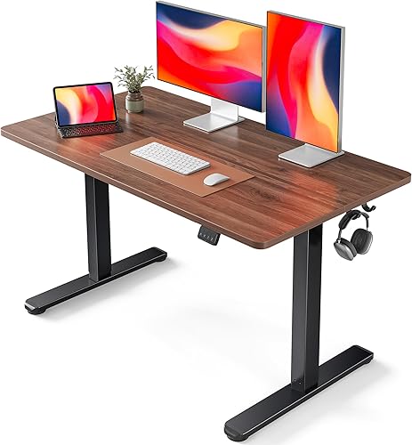 FEZIBO Escritorio eléctrico de pie ajustable en altura, mesa de pie de 48 x 24 pulgadas, escritorio de oficina en casa con tablero de empalme, nogal